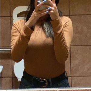 A long sleeve shirt. You can dress it down or up very stretchy.